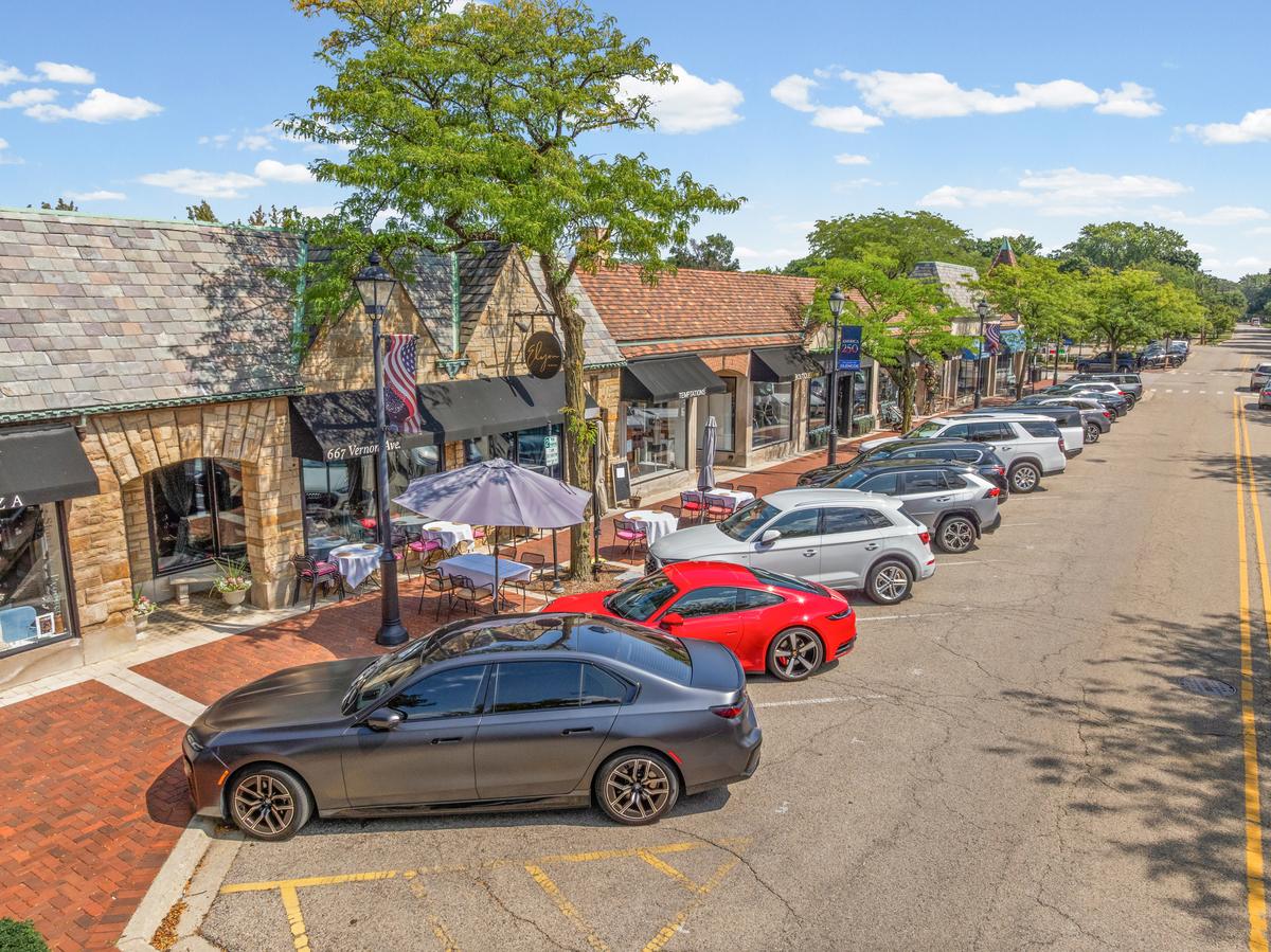Storefronts and angled parking along a downtown Glencoe street
