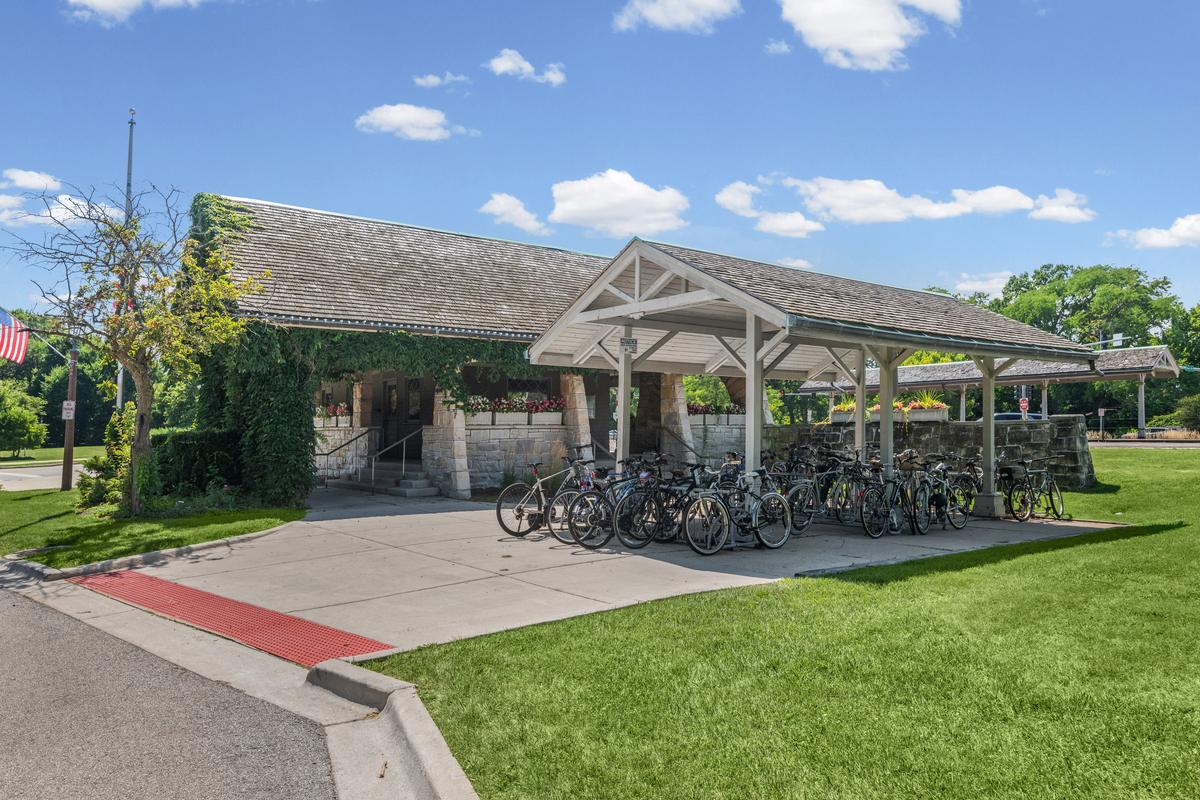 Bicycles parked under the canopy at the Kenilworth Metra station