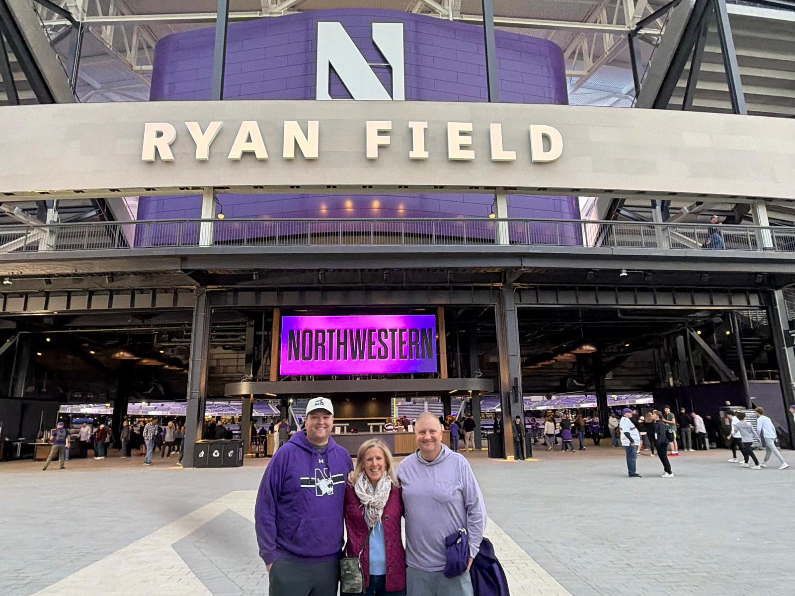 Alex Harris with his parents, John and Coco Harris, outside the new Ryan Field in Evanston, Illinois