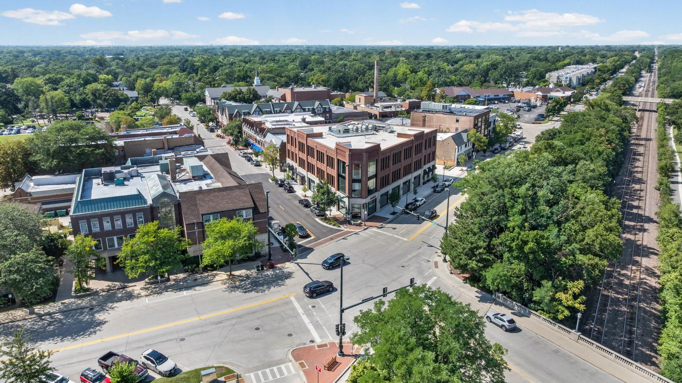 Aerial view of Winnetka's Elm Street district with the Metra Union Pacific North Line running through the village